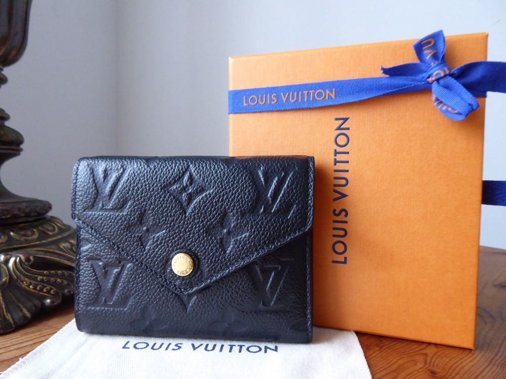 SOLD ••• ————————— Louis Vuitton Victorine Noir Empriente Leather Compact  Wallet : $585 ——— Comes with original tags : guaranteed…