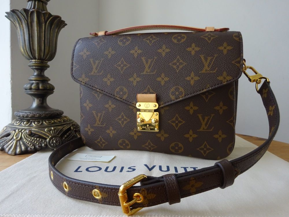 louis vuitton with gold plate on front
