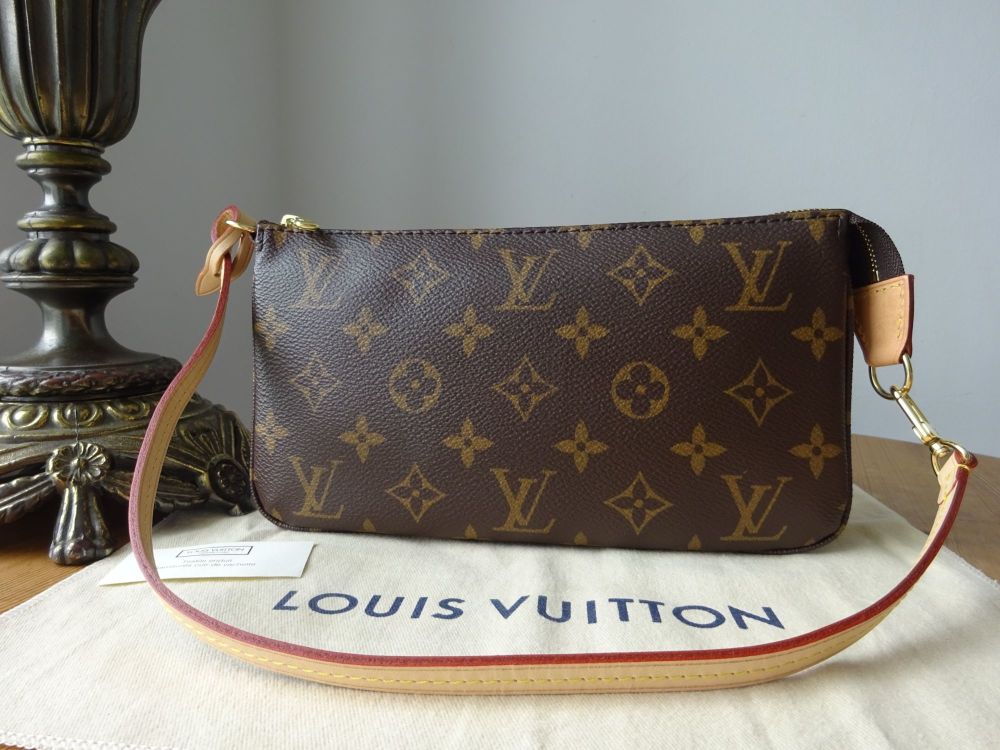 Louis vuitton bag with the brown and light brown monogram on one side, and  black and dark gray borders. made of leather and featuring a square shape  with the gold lv logo