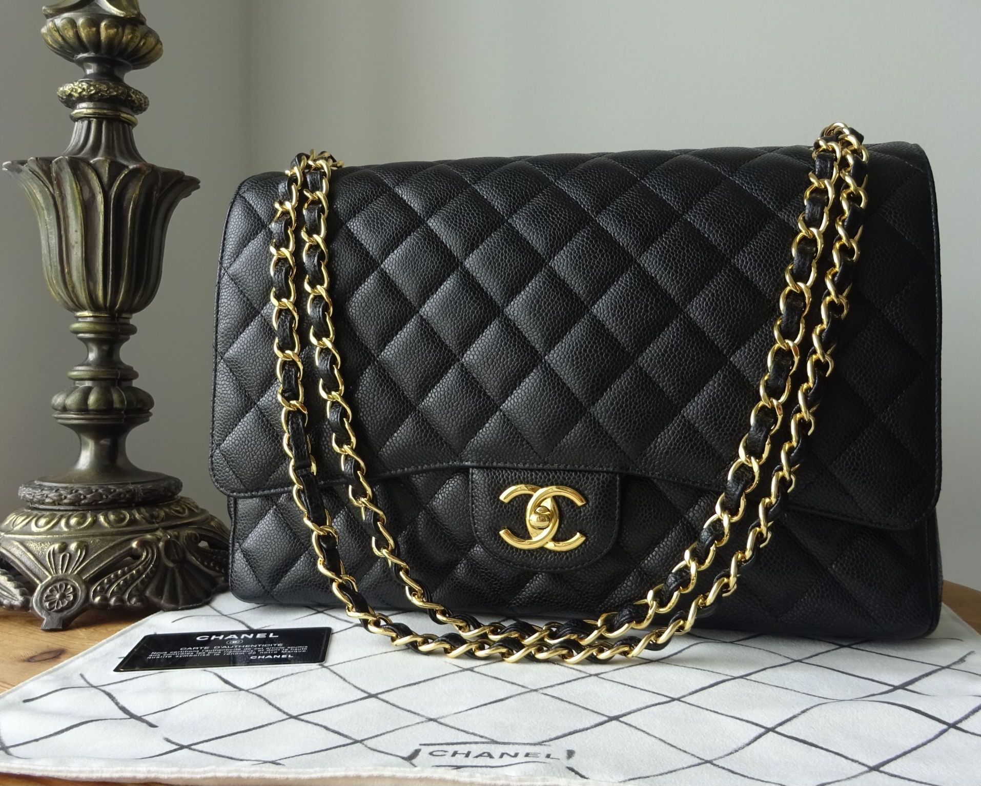Chanel Classic Maxi Double Flap in Black Caviar with Gold Hardware