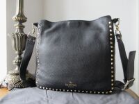 Valentino Garavani Rockstud Fliplock Crossbody Hobo in Black Pebbled Calfsk