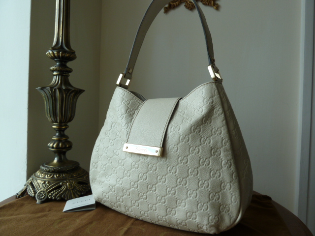 Gucci Ivory Guccissima Leather Engraved Bar Hobo - SOLD