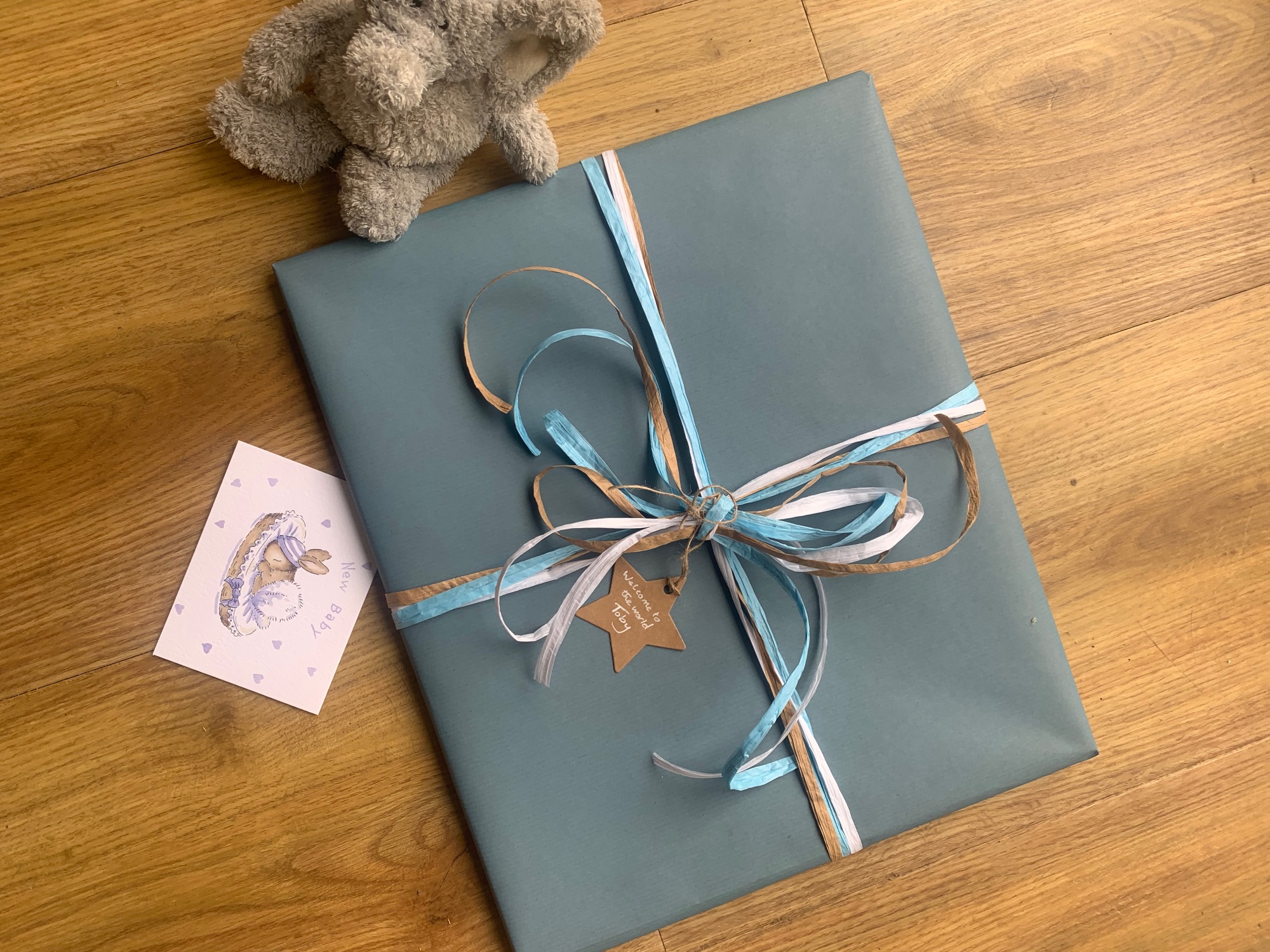 Baby boy gift wrap with Kraft ribbon