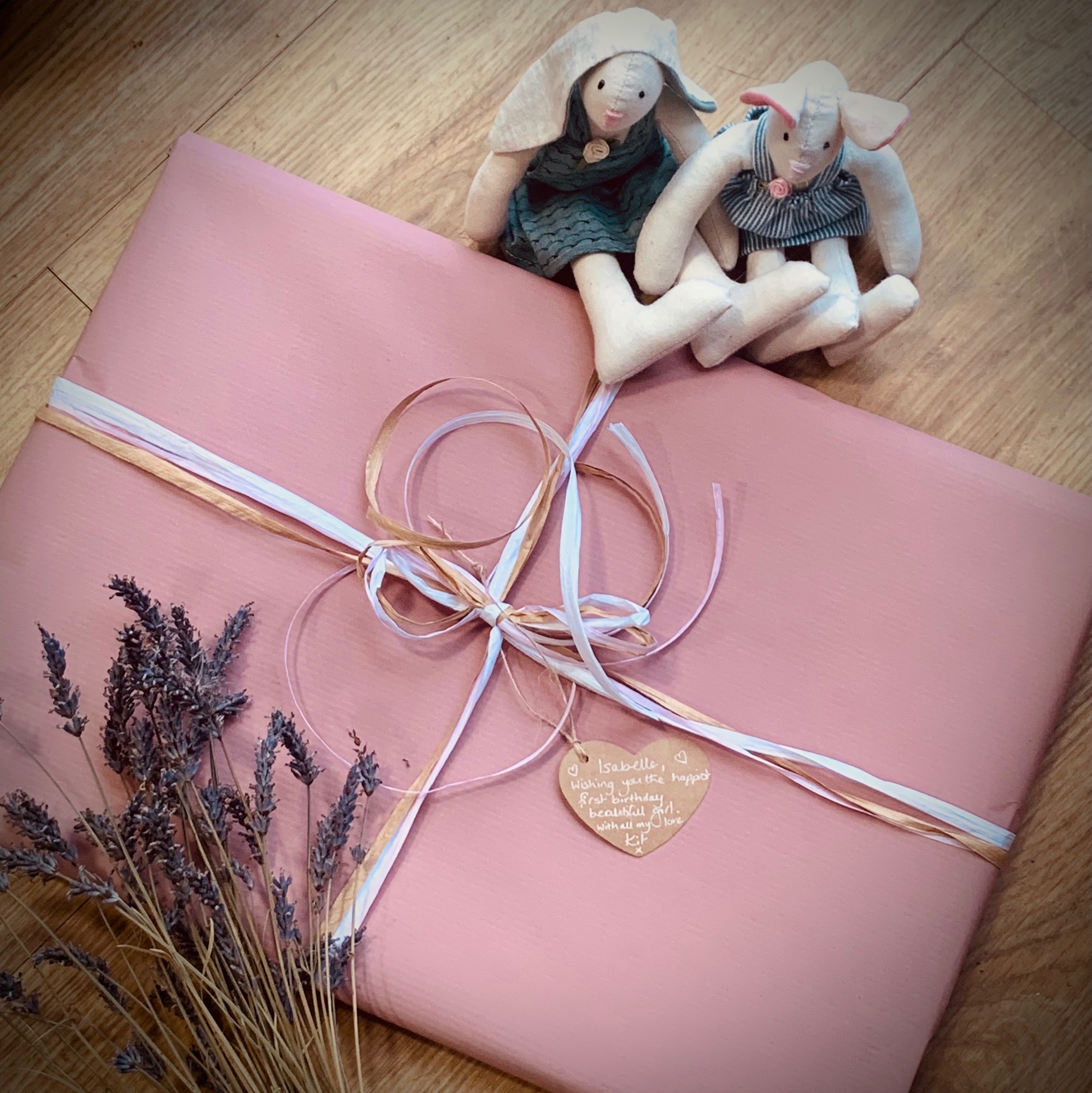 Baby girl gift wrap with kraft ribbon