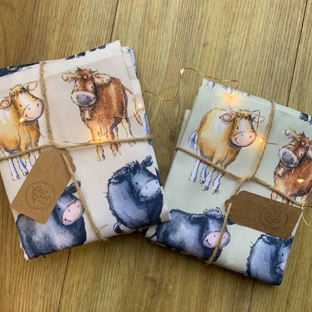 Cow breeds tea towel green