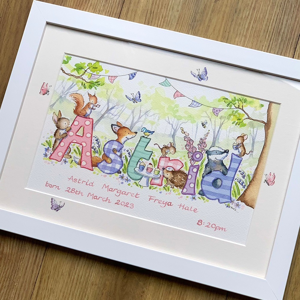 Woodland nursery design with trees, bunting and personalised name