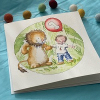 Close up of hand painted watercolour illustration on personalised children&acirc;s birthday card
