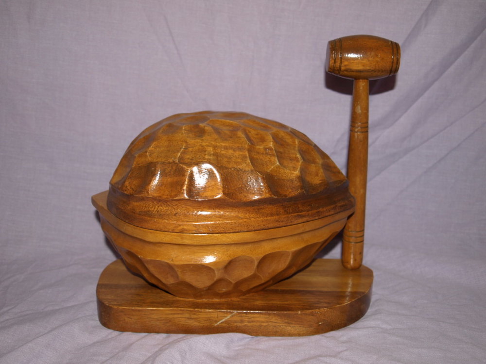 Large Wooden Nutcracker In The Shape Of A Walnut And Mallet.