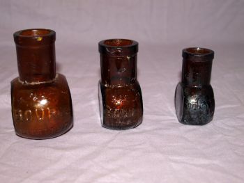 Antique Set of Three Amber Glass Bovril Jars. (2)