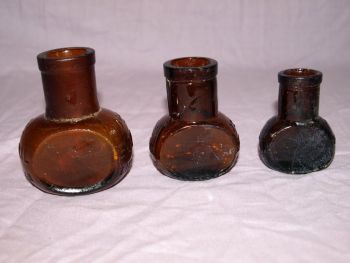 Antique Set of Three Amber Glass Bovril Jars. (3)