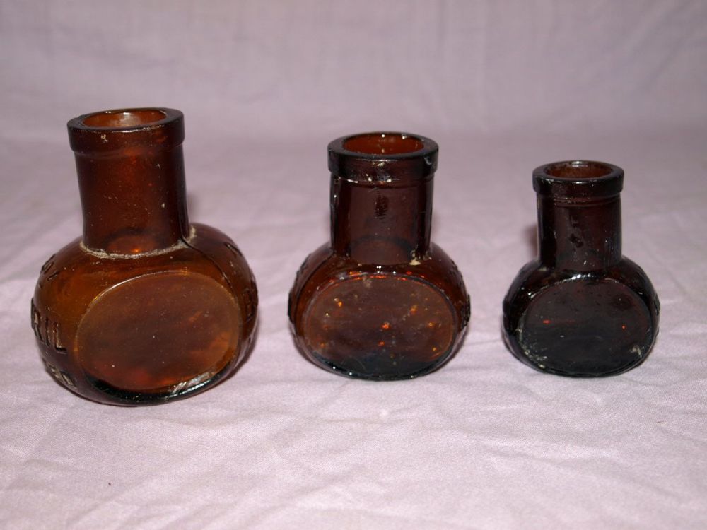 Antique Set of Three Amber Glass Bovril Jars.