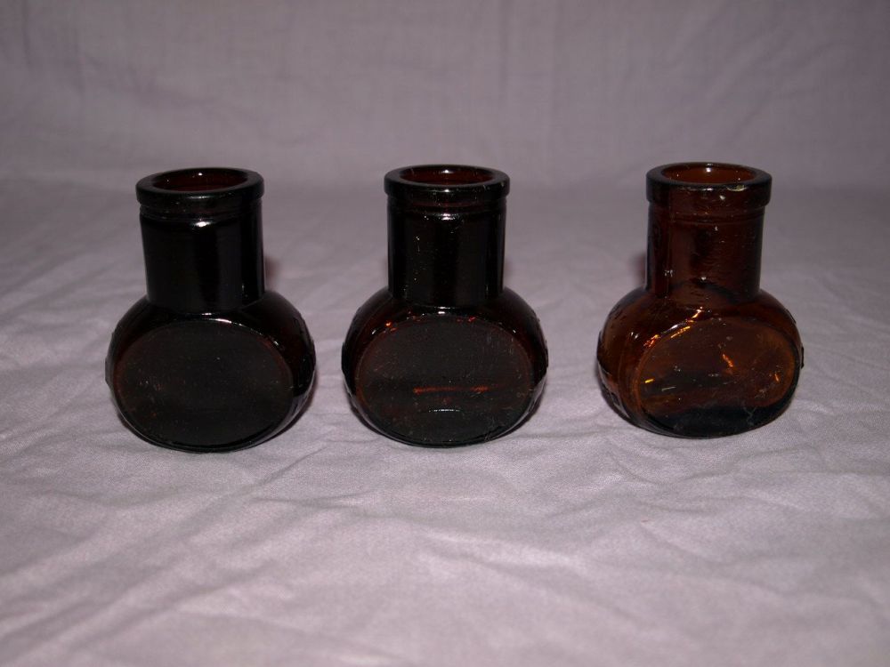 Antique Set of Three Amber Glass 2 oz Bovril Jars.