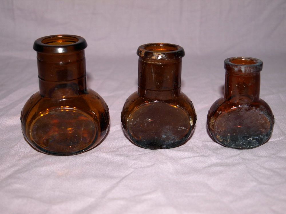 Vintage Set of Three Amber Glass Bovril Jars.