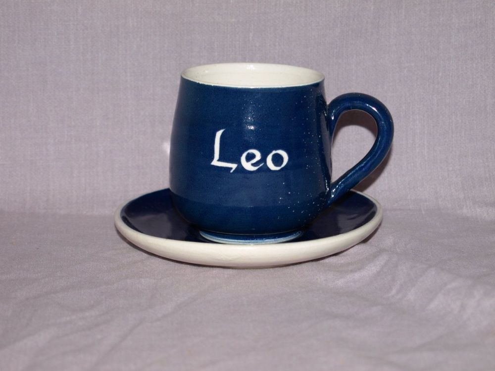 Rainham Pottery Cup and Saucer, Personalised ‘Leo’.