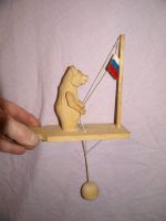 Carved Wooden Russian Bear and Flag Toy. (6)