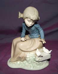 Nao Lladro Girl and Doves figure.