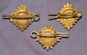 Three Brass Enamel Officer Pips (2)