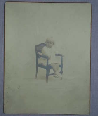 1920’s Photograph of a Seated Child. 