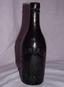 G A Barrasford Dark Green Victorian Bottle.