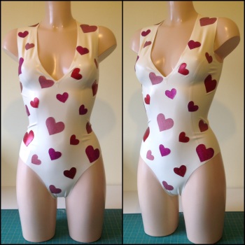 Heart Appliqué Bodysuit With Plunging Neckline.
