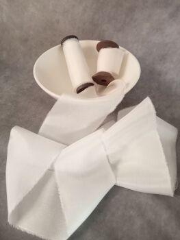  White silk ribbon.