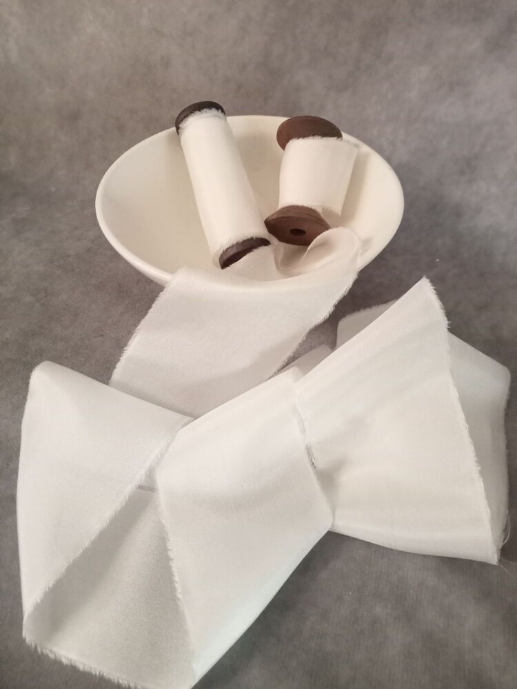 <!-- 021 --> White silk ribbon.