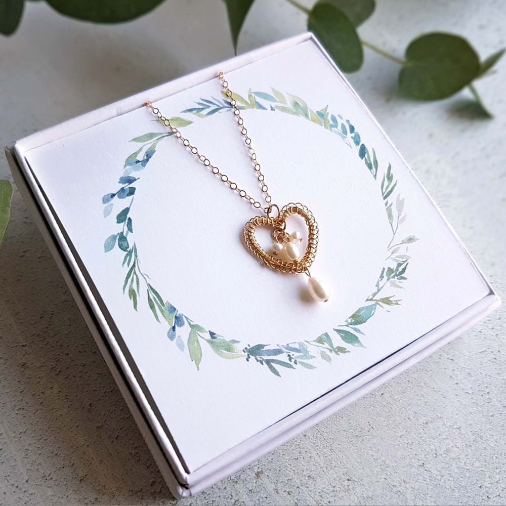 Gold heart pendant with pearls