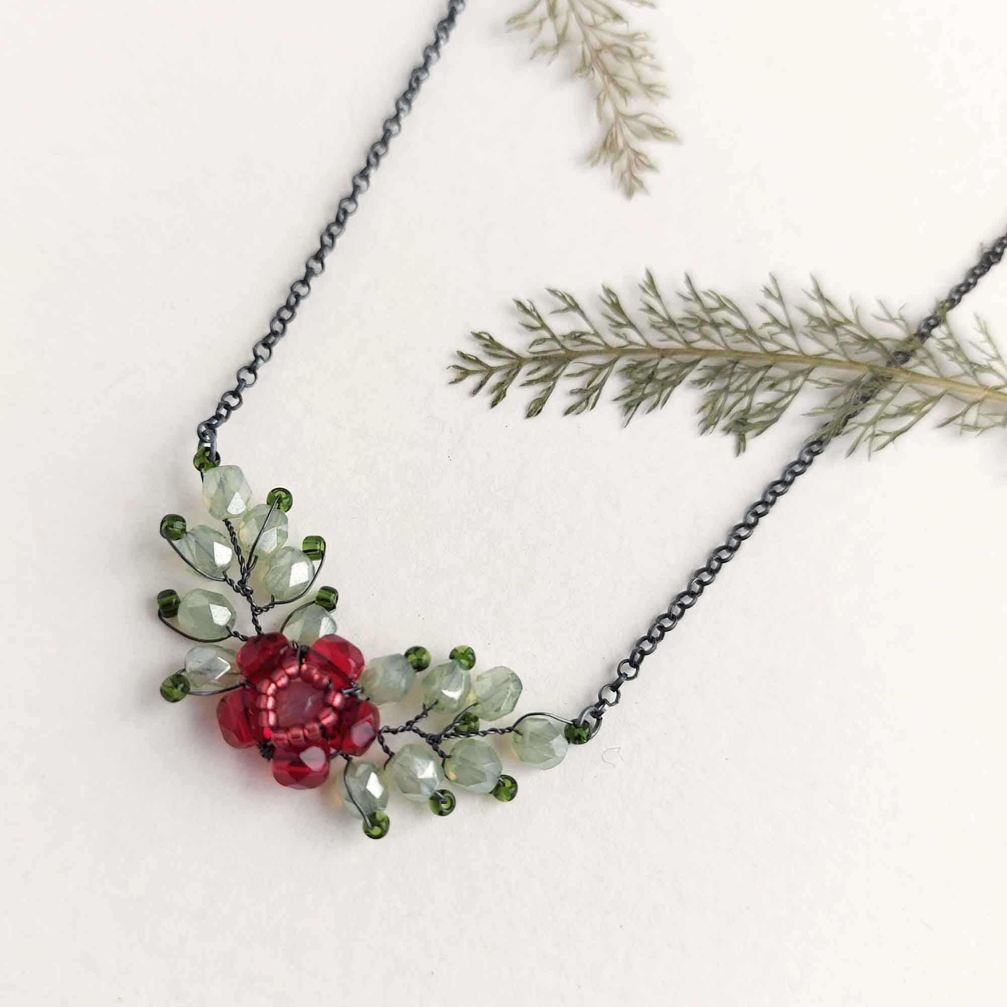 Beaded silver leaf and flower necklace in red and green