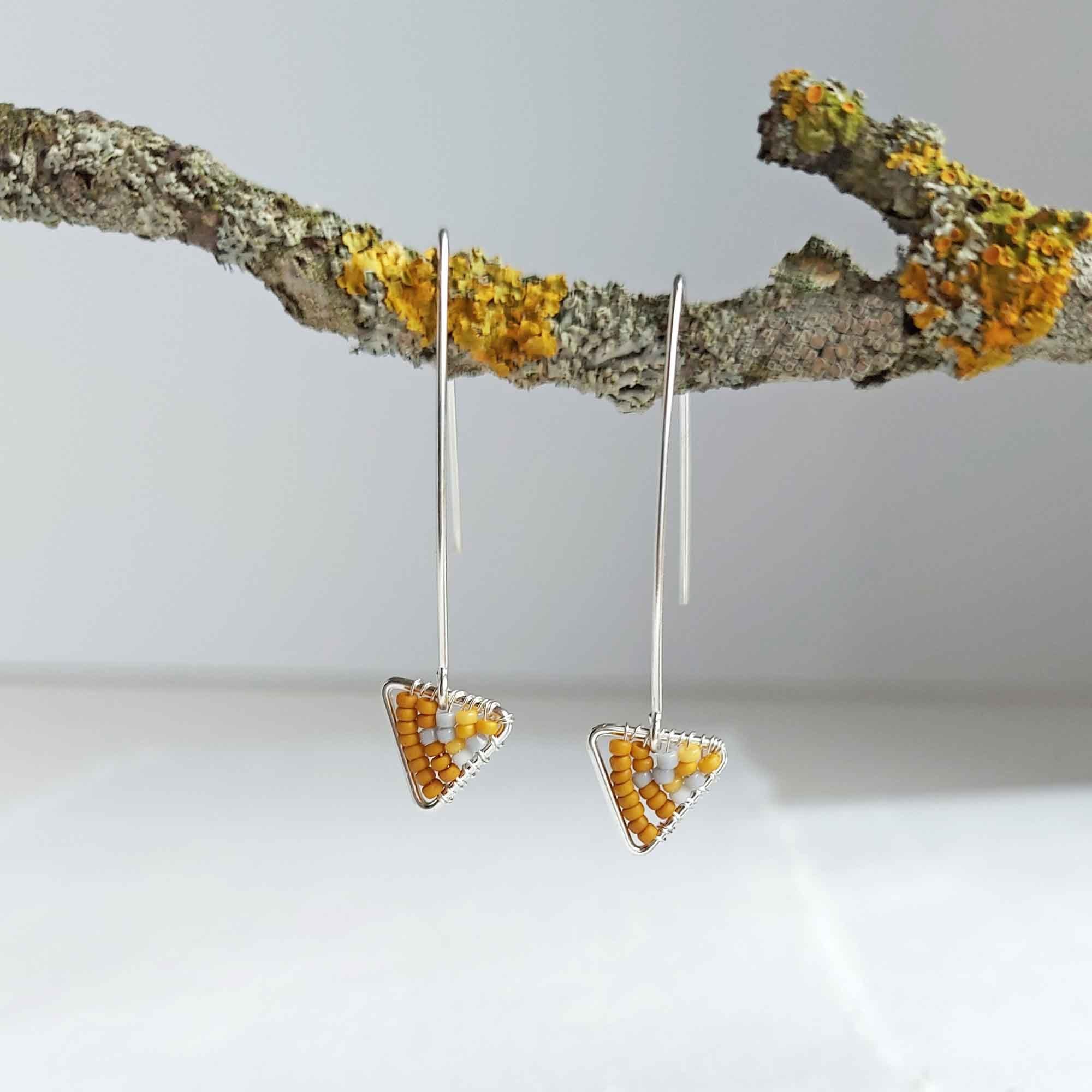 Beaded geometric traingle earrings in mustard and grey