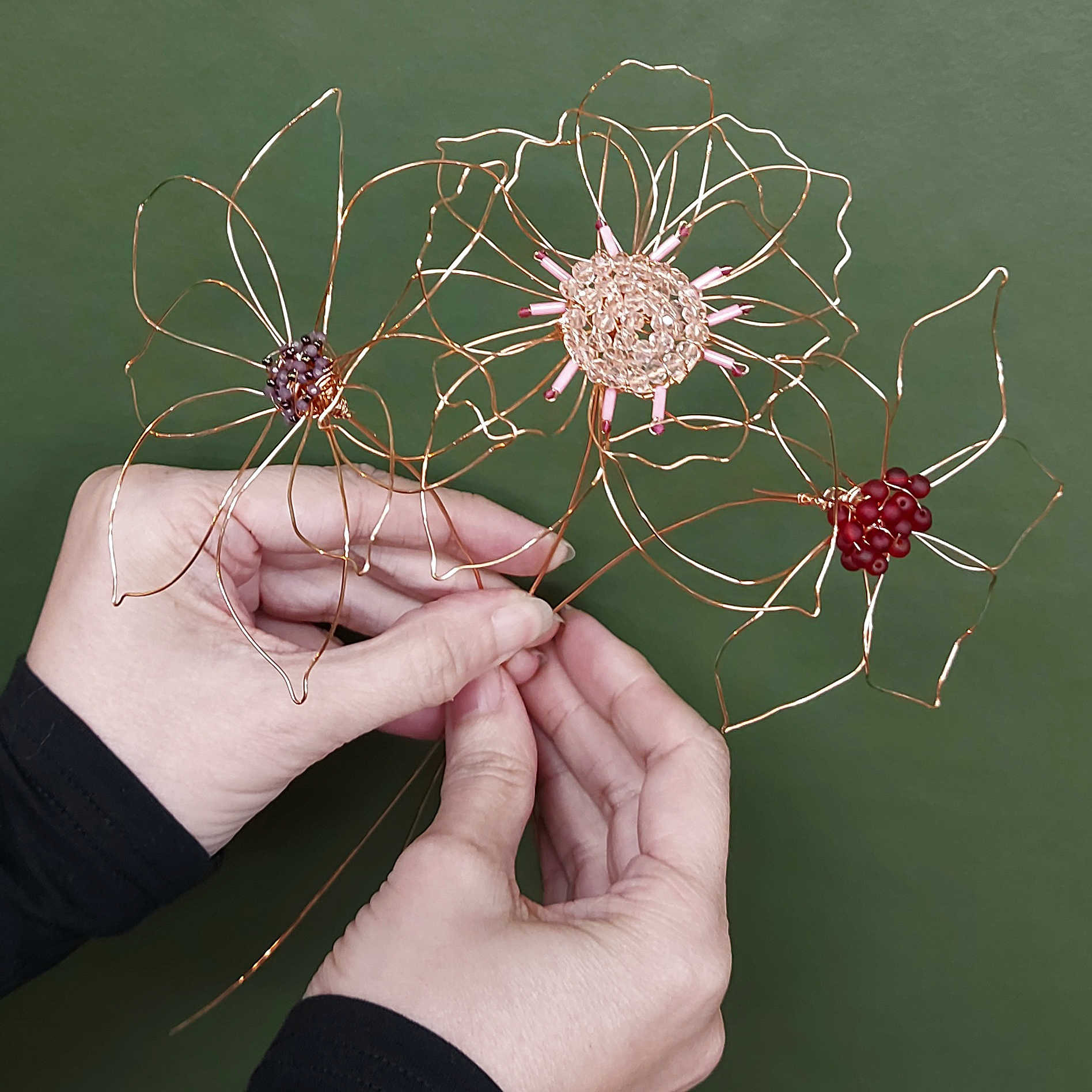 workshop participant wearing her hand embroidered earrings