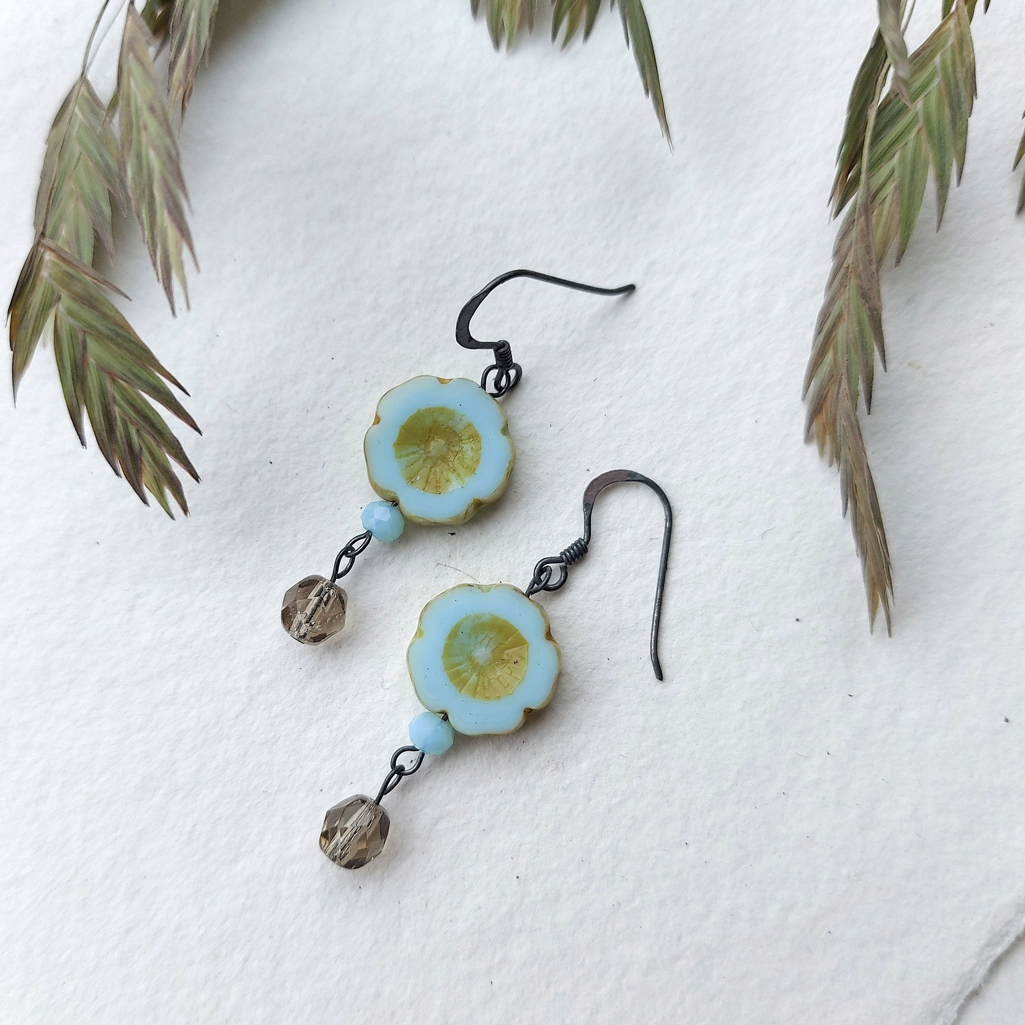 Flower beaded blue drop earrings handmade by Judith Brown