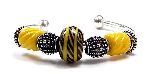 Cartimandua - bangle with focal bead based on a Scottish Iron Age bead with black and yellow twisted glass cable