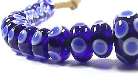 37 blue and white eye beads in graduated sizes