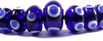 Cobalt blue and white eye beads, a graduated set of 31 beads 
