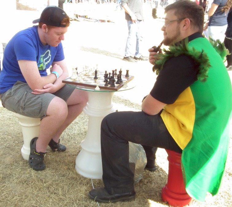 A pipe smoker playing a game of "small" chess.