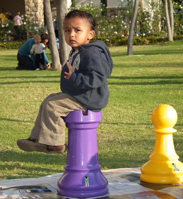 sitting on a purple rook