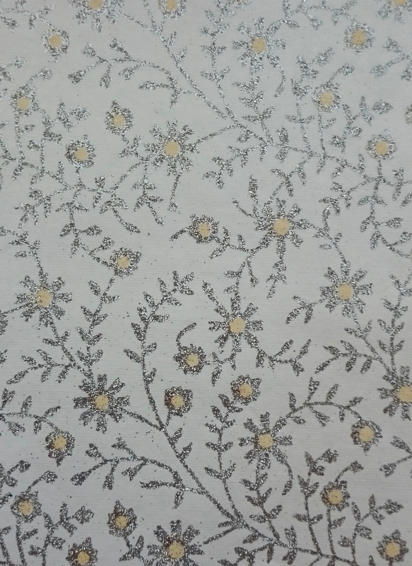 Beautiful hand made glittered paper. White background with silver glittered flower design with yellow dots.  A5. Pack of 15