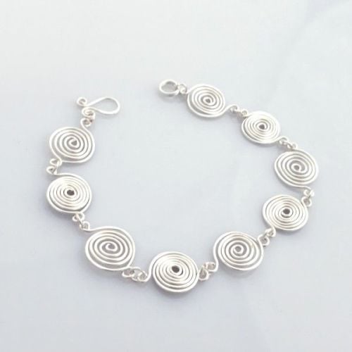 Open and Closed silver spirals bracelet