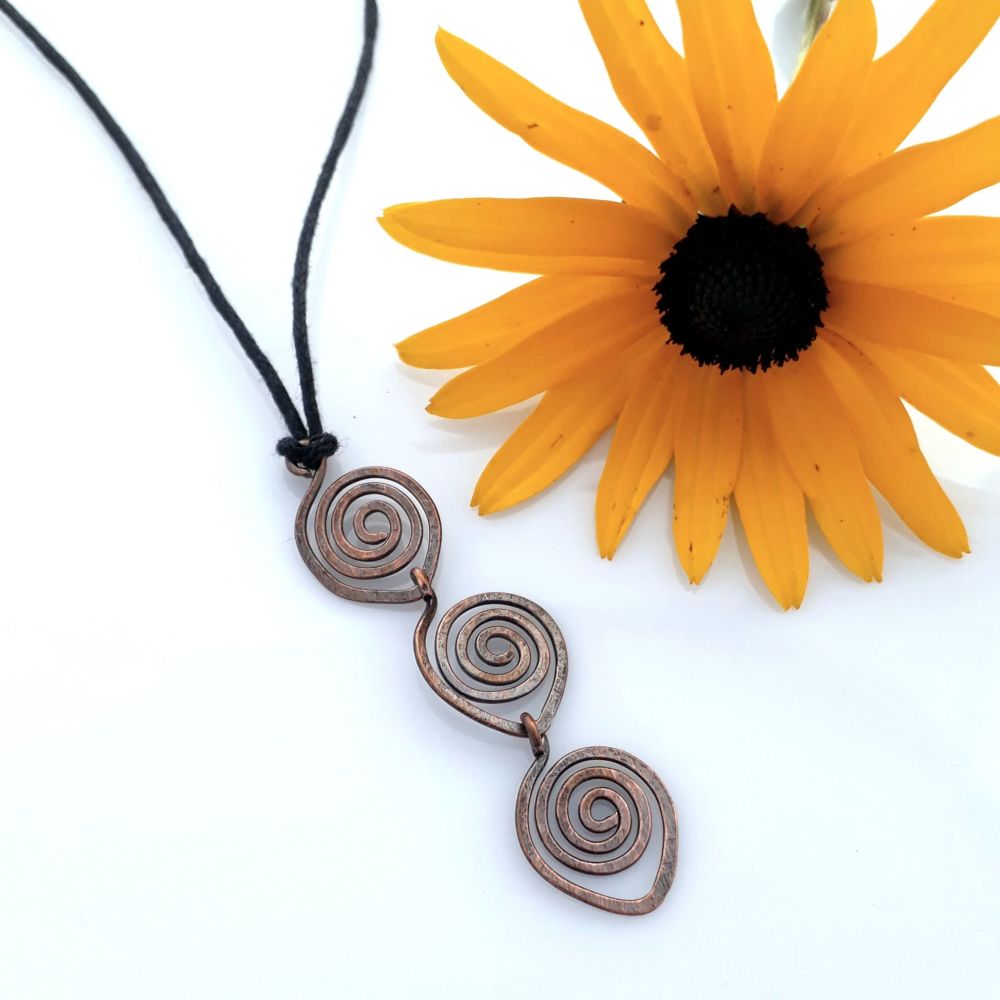 Triple spiral copper pendant