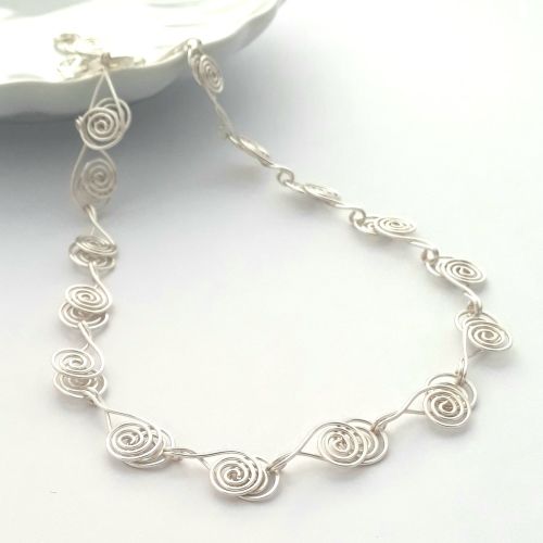 Cross over Silver Spiral necklace