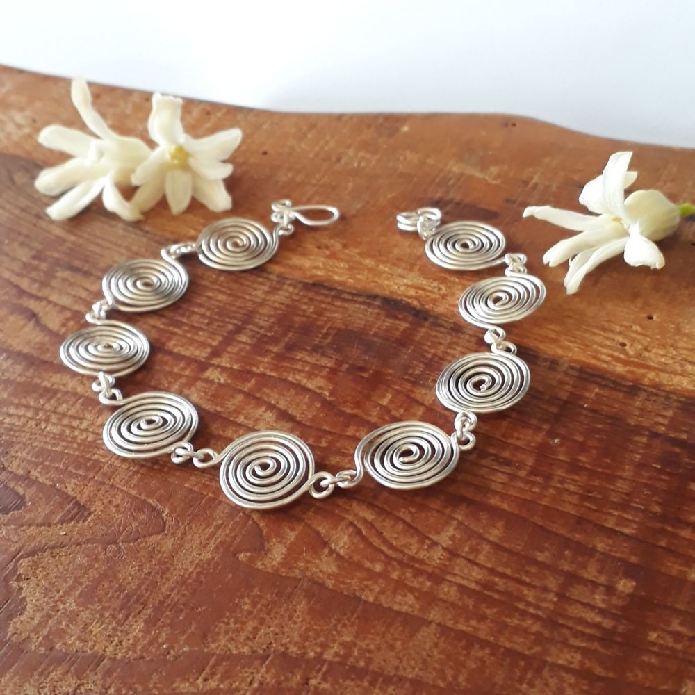 Open silver spirals bracelet