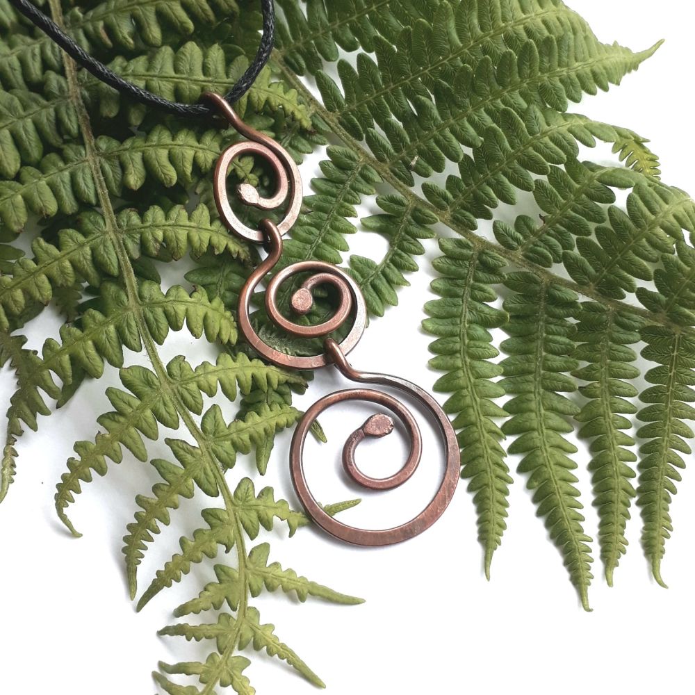 Triple spiral copper pendant
