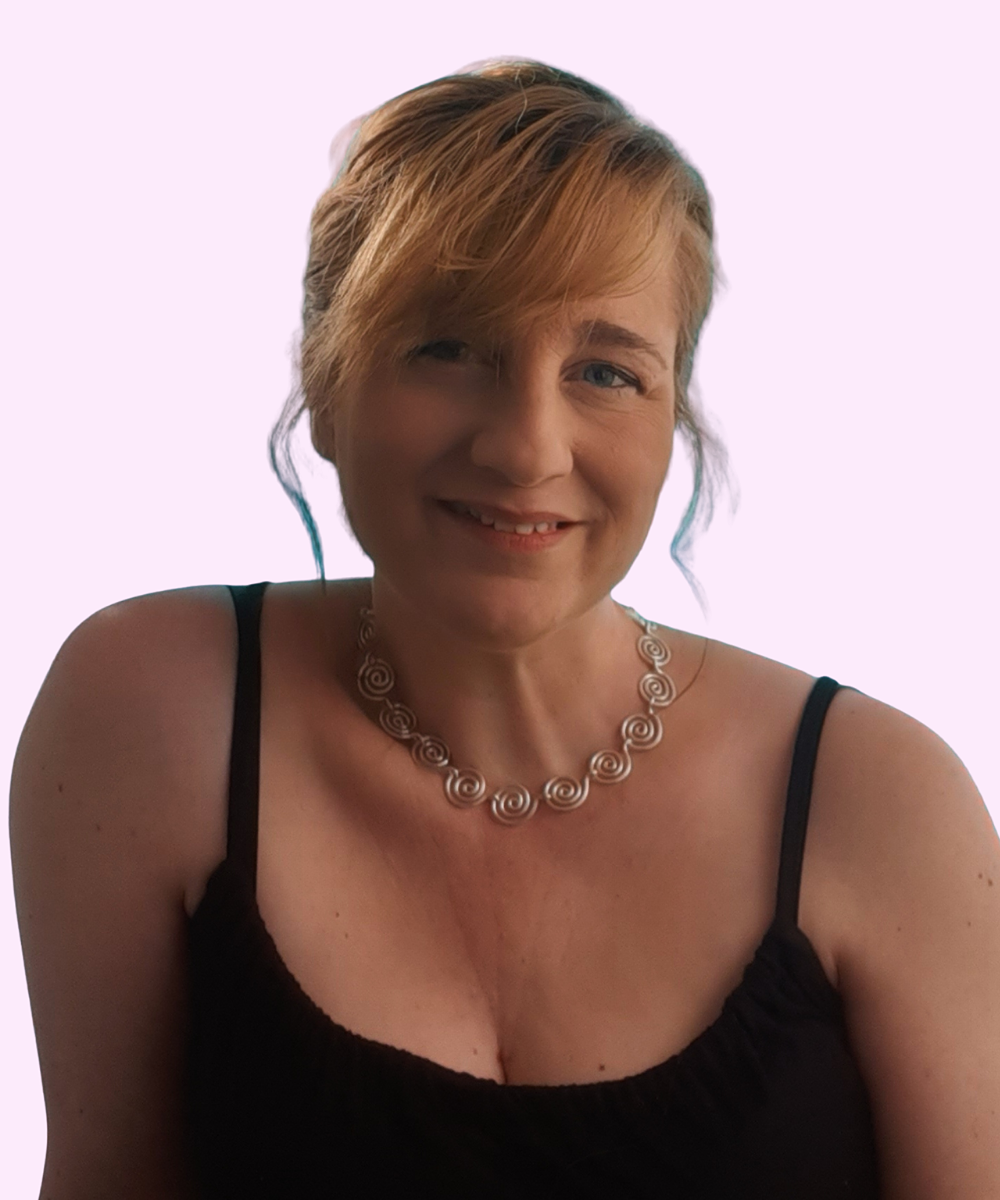 Jewellery designer wearing handmade silver spiral necklace