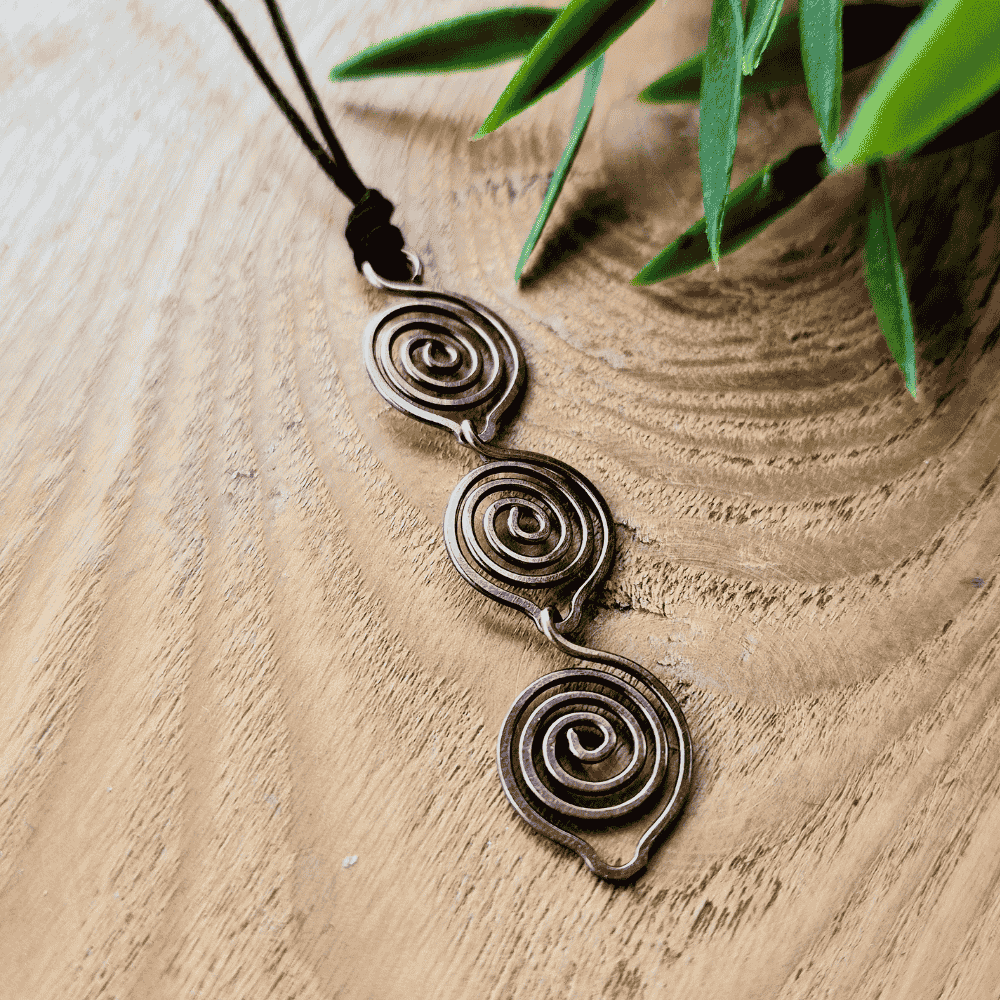 Triple spiral copper pendant