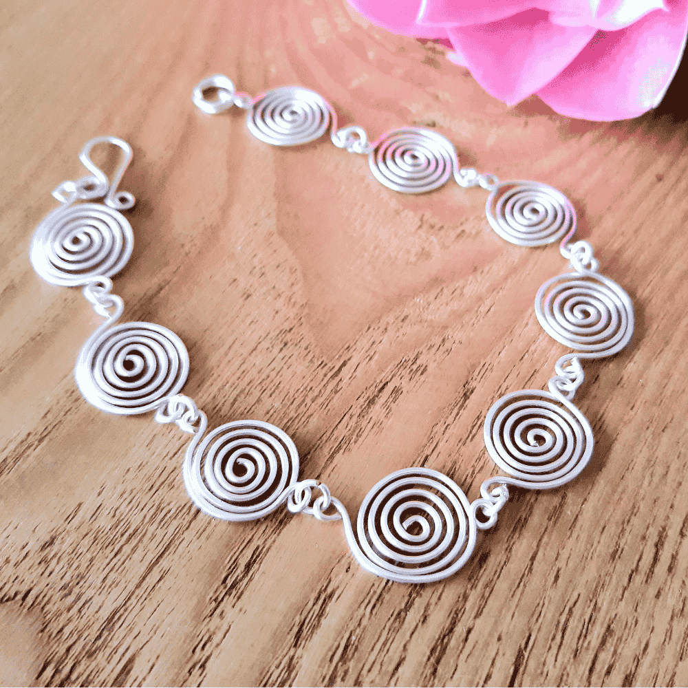 4 Open silver spirals bracelet