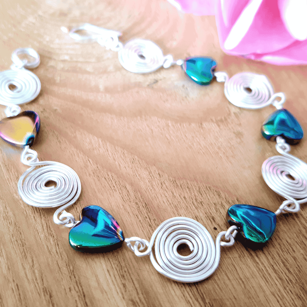 Rainbow hematite and silver spiral bracelet