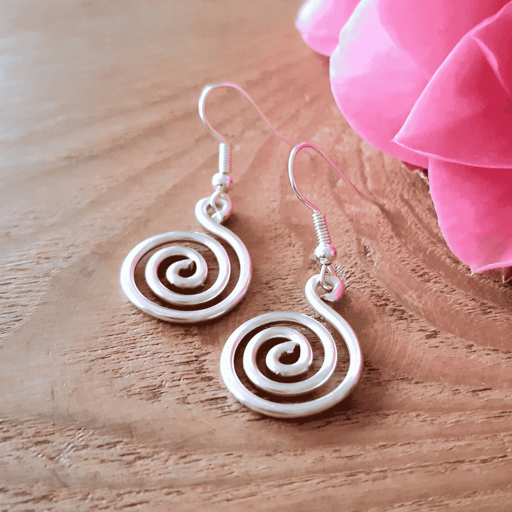 2 Chunky silver spiral earrings