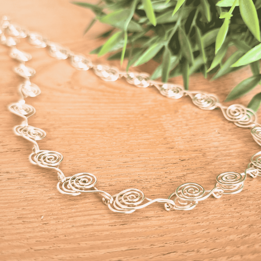 Cross over Silver Spiral necklace