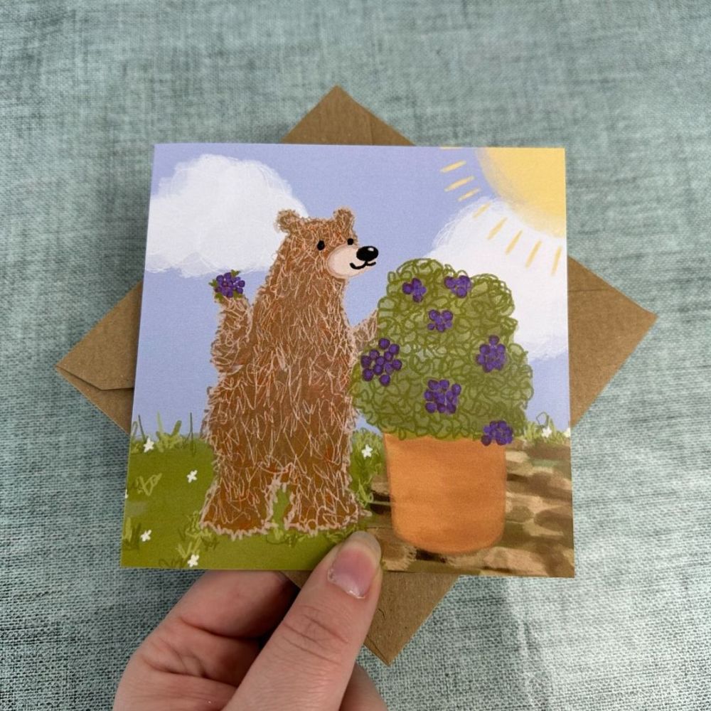 Cheeky bear taking berries Greetings Card