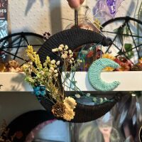 Black Macrame Moon Decoration with wildflowers and crystal chipped web